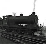 Class J37 0-6-0 No. 64569 leaves shed to  commence duties.