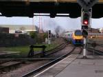 222004 goes North as 60007 waits to enter Leicester.